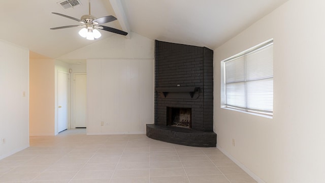 unfurnished living room featuring ceiling fan, a fireplace, light tile patterned flooring, and lofted ceiling with beams