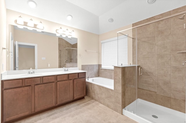 bathroom featuring tile patterned floors, vanity, and plus walk in shower