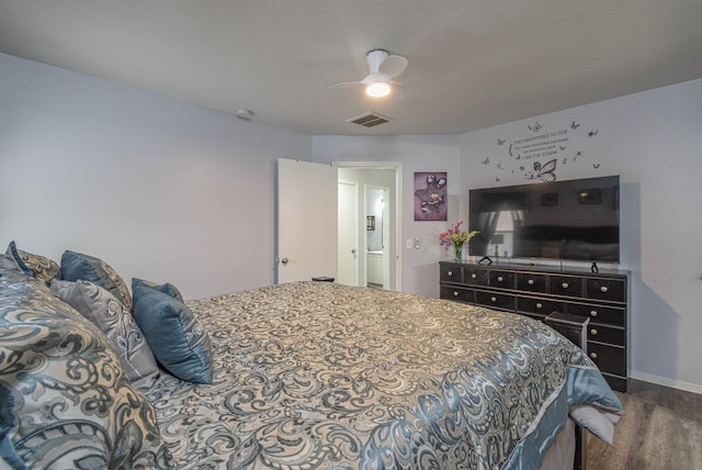 bedroom with ceiling fan and wood-type flooring