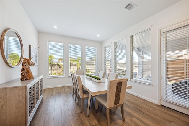 dining area with wood-type flooring