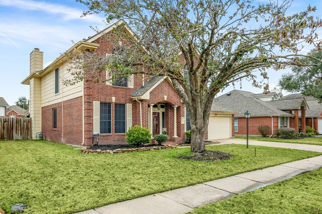 front of property featuring a garage and a front lawn