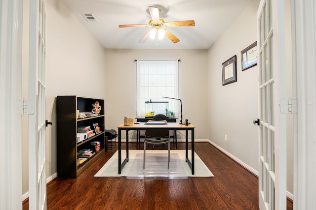 office area featuring dark wood-style floors, baseboards, visible vents, and a ceiling fan