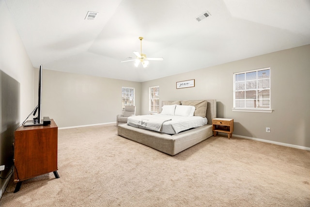 bedroom with baseboards, vaulted ceiling, and carpet flooring