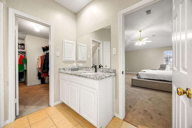 bathroom featuring vanity, tile patterned flooring, and ceiling fan