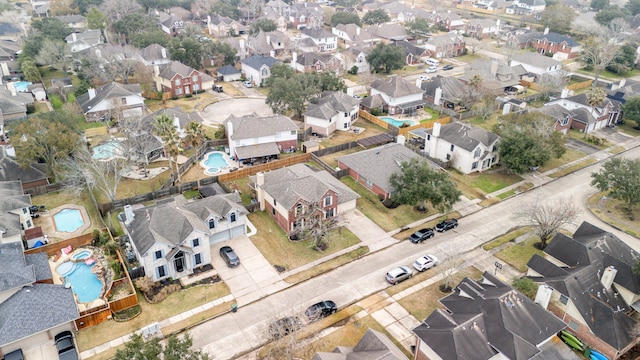 birds eye view of property with a residential view