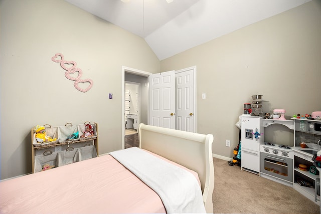 bedroom with vaulted ceiling and light carpet