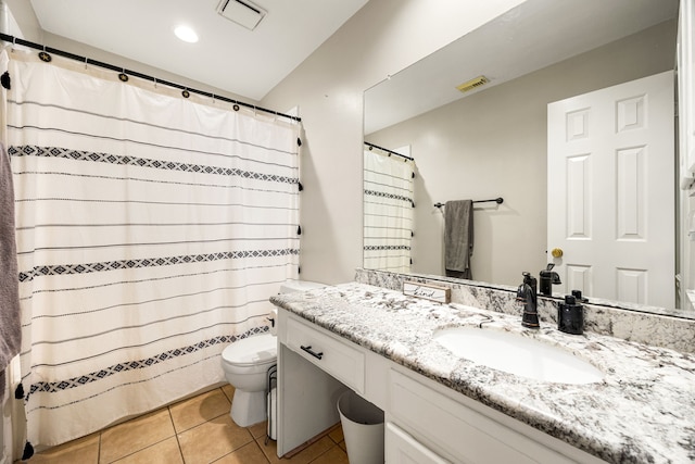 full bathroom with toilet, vanity, visible vents, and tile patterned floors