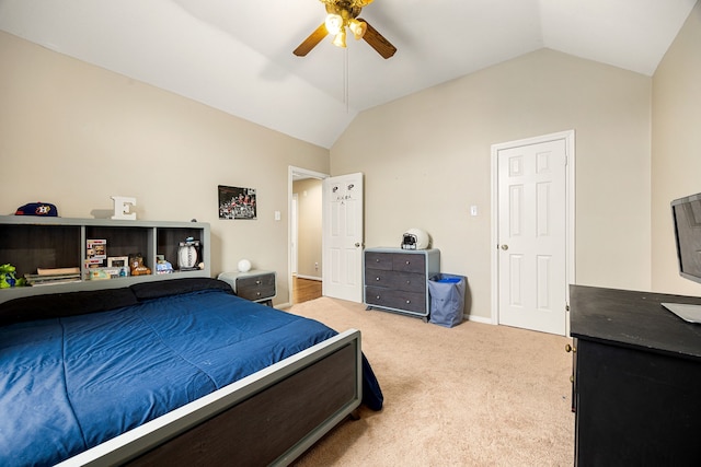 bedroom featuring carpet floors, vaulted ceiling, and ceiling fan