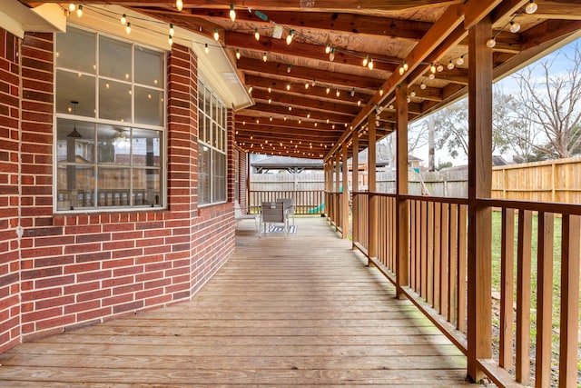 deck with a fenced backyard