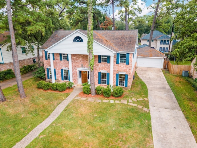 view of front of home featuring a front lawn and a garage