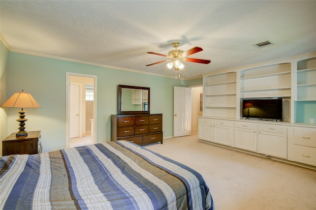 carpeted bedroom with crown molding, ceiling fan, ensuite bath, and a textured ceiling