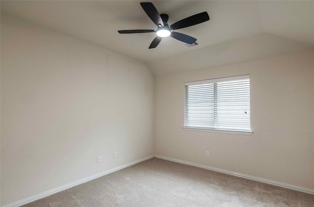 carpeted empty room with ceiling fan and lofted ceiling