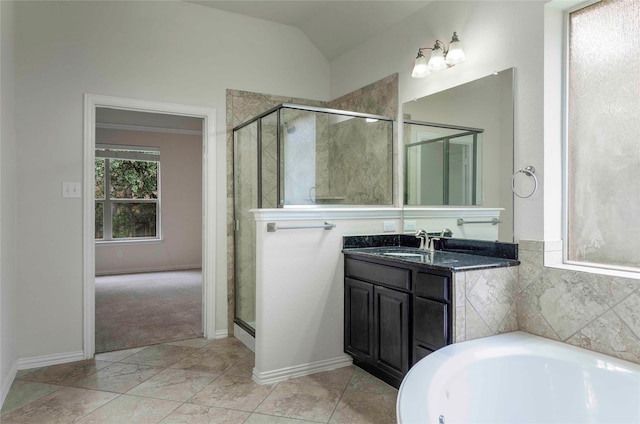 bathroom with vanity, lofted ceiling, and shower with separate bathtub