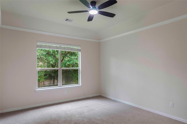 carpeted empty room featuring ceiling fan and crown molding