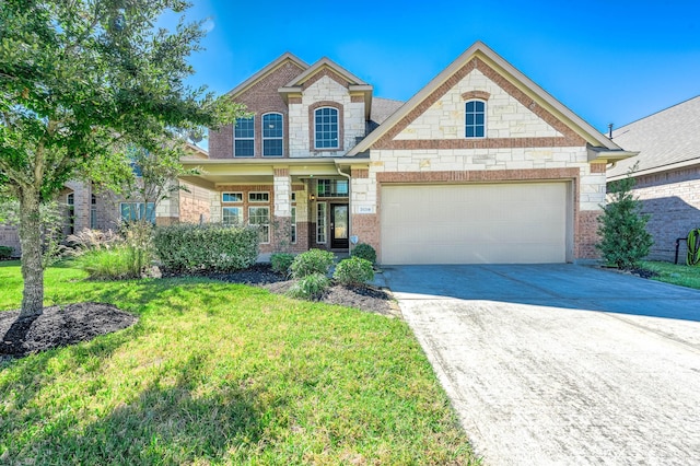 craftsman-style home with a garage and a front lawn