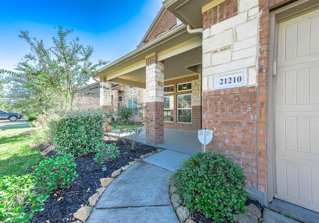 doorway to property with covered porch