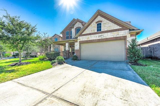 view of front of home featuring a garage and a front lawn