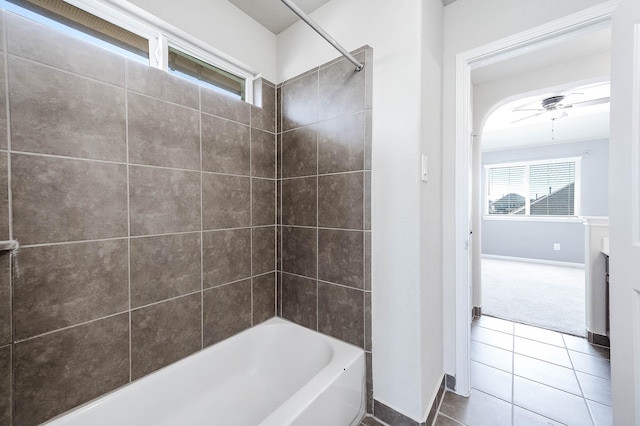 bathroom featuring tile patterned flooring, ceiling fan, and tiled shower / bath