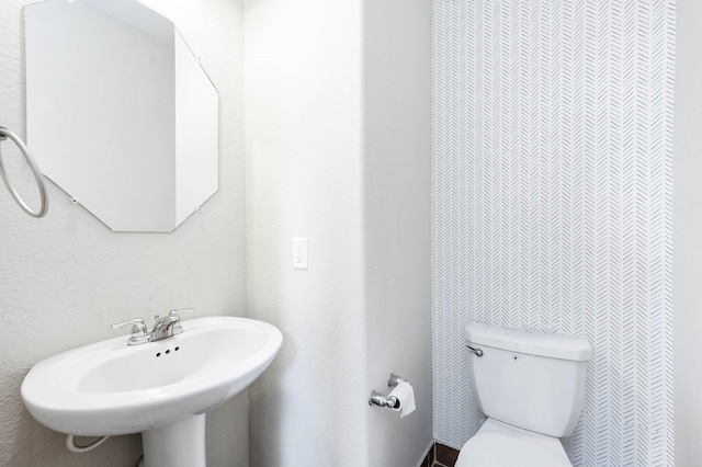 bathroom with sink and toilet