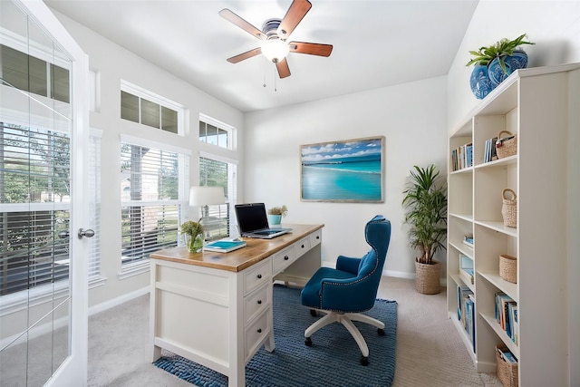 carpeted office with ceiling fan