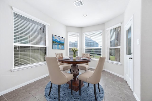 dining room with tile patterned flooring