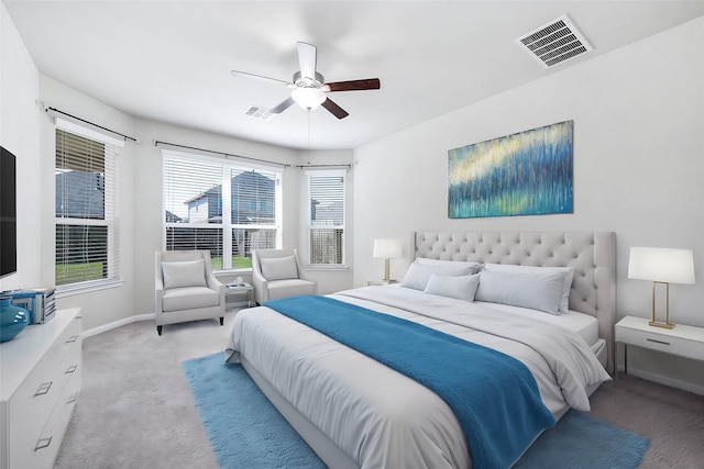 bedroom featuring ceiling fan and light carpet