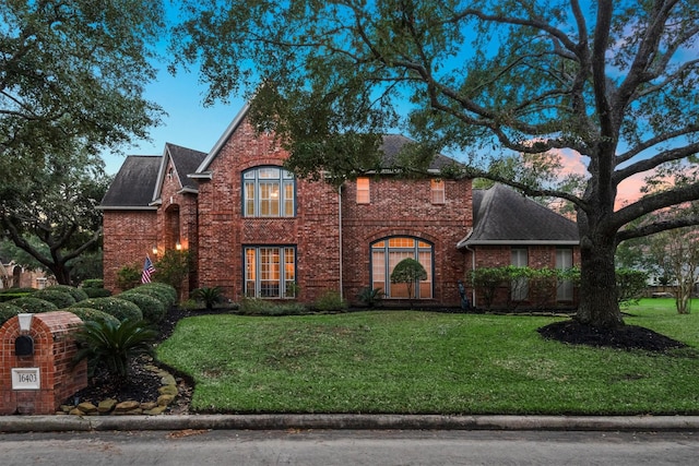 view of front of property with a yard