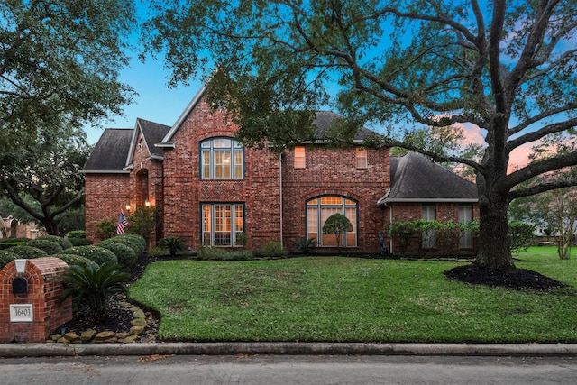 16403 Agusta Ct, Spring, TX 77379 - view of front of property with a front yard, a shingled roof, and brick siding