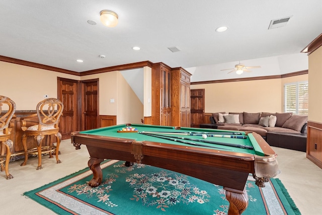 recreation room with ceiling fan, billiards, light colored carpet, wooden walls, and ornamental molding