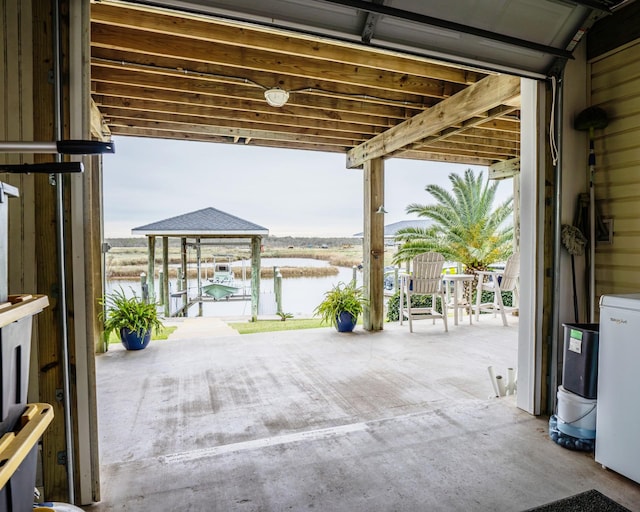 view of patio featuring a water view