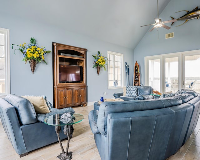 living room with ceiling fan and lofted ceiling