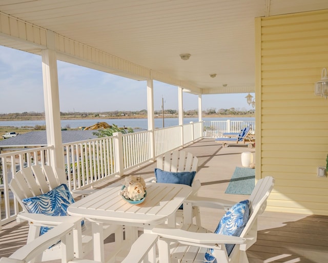 wooden deck featuring a water view