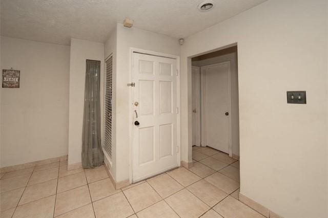 hallway with light tile patterned flooring