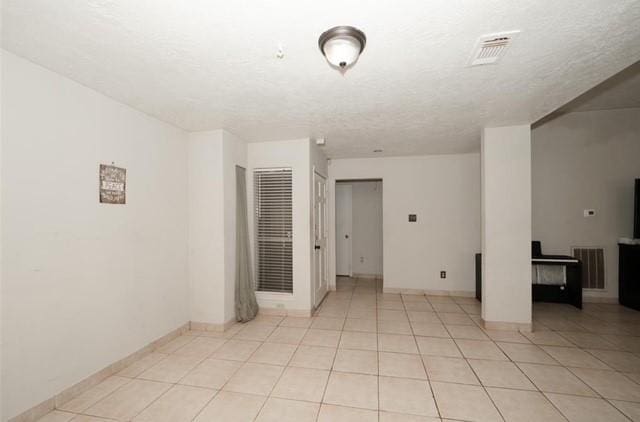 empty room with light tile patterned floors