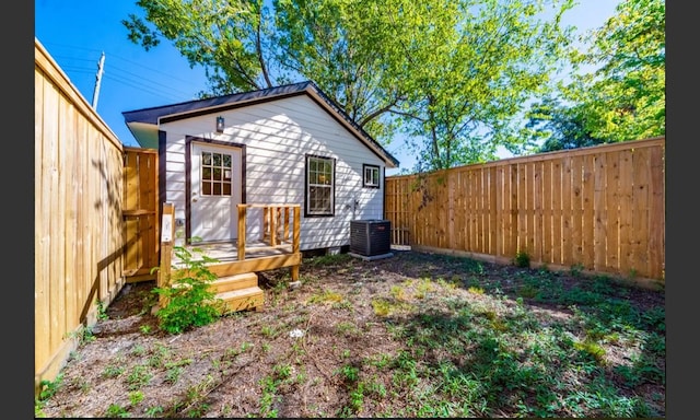 back of house with cooling unit