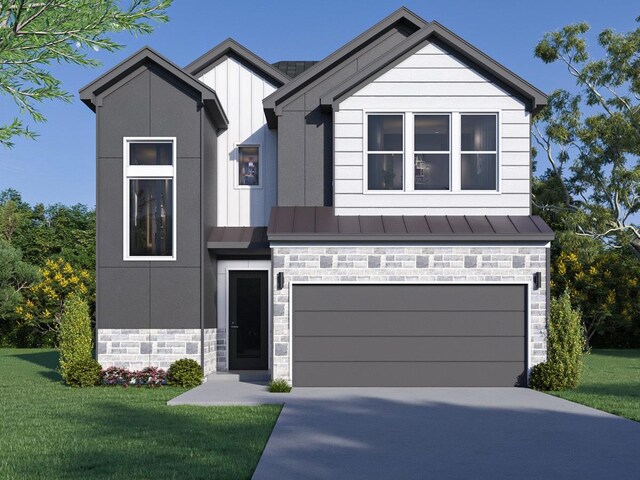 view of front facade with a front yard and a garage