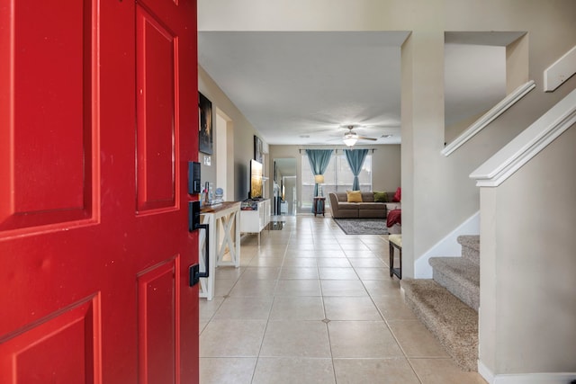 tiled foyer entrance featuring ceiling fan