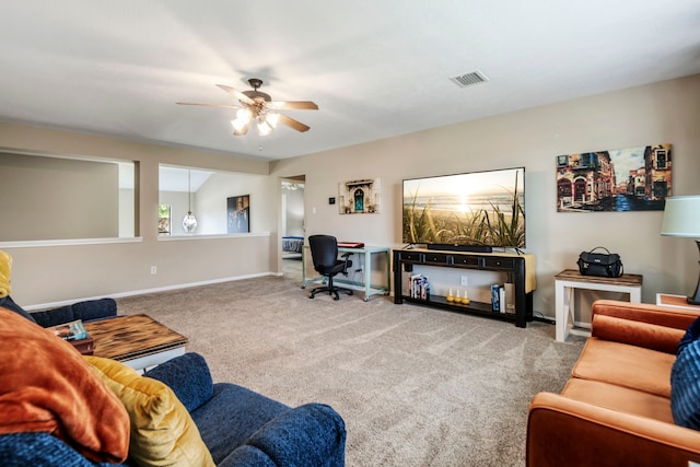 carpeted living room featuring ceiling fan