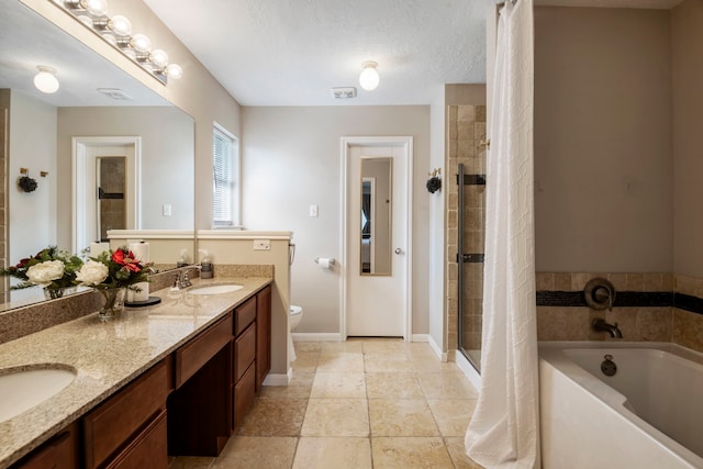 full bathroom with vanity, separate shower and tub, toilet, and a textured ceiling