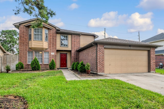 view of front of home with a garage and a front lawn