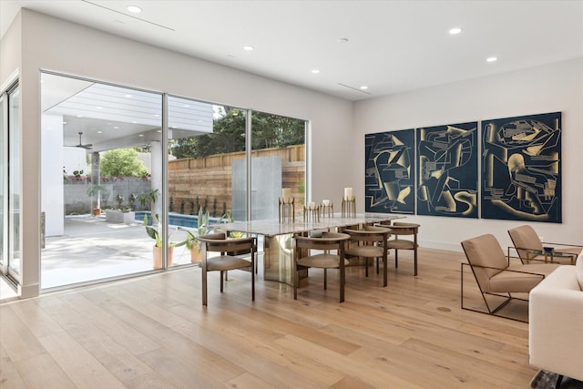 dining space with light wood-type flooring