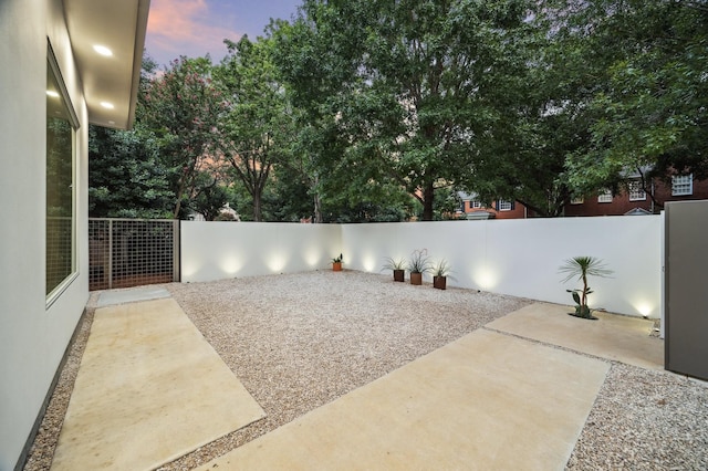 view of patio terrace at dusk