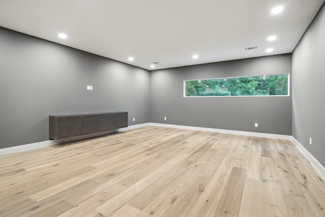 spare room with light hardwood / wood-style floors