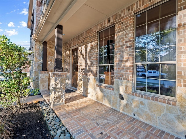 entrance to property featuring a porch