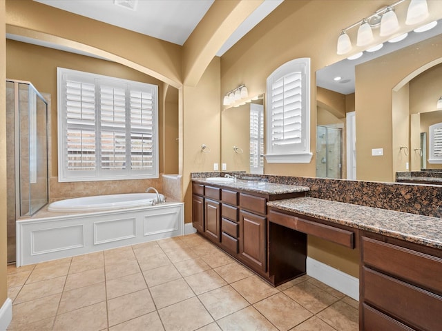 bathroom with vanity, tile patterned flooring, and separate shower and tub