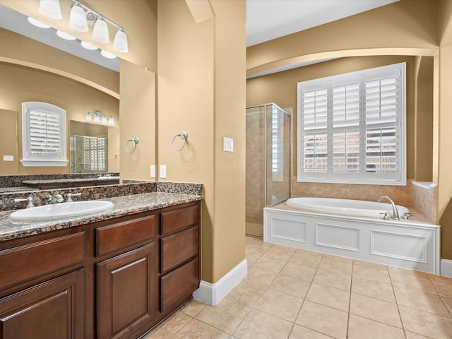 bathroom featuring vanity, tile patterned floors, and shower with separate bathtub