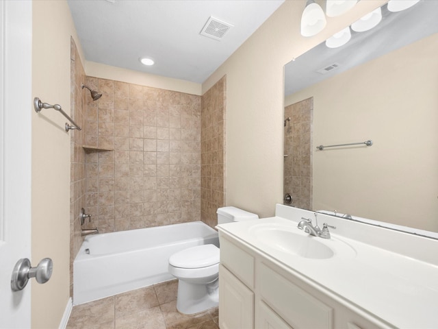 full bathroom with toilet, vanity, tile patterned floors, and tiled shower / bath combo