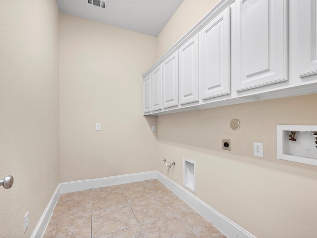 washroom featuring cabinets, hookup for a washing machine, hookup for an electric dryer, hookup for a gas dryer, and light tile patterned flooring