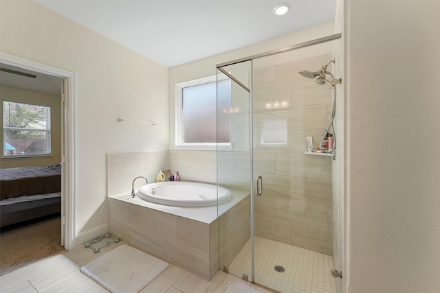 bathroom with tile patterned flooring and independent shower and bath