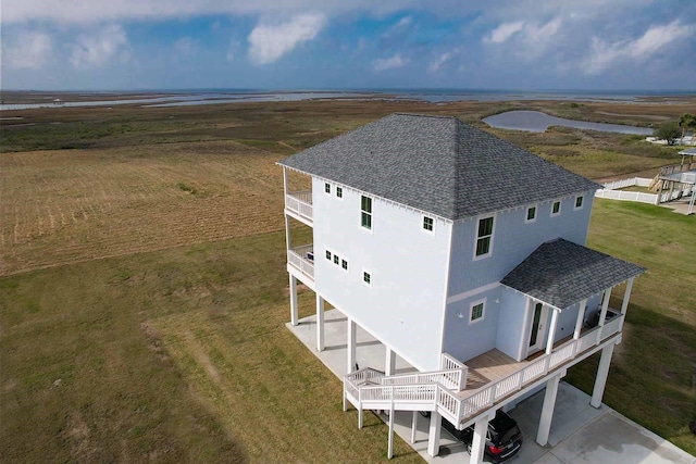 birds eye view of property with a rural view